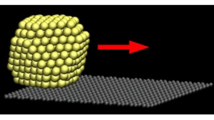 A gold (Au) octahedron sliding over a graphite substrate after being given a 'kick'