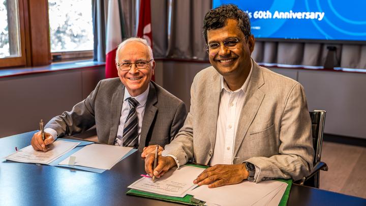 Atish Dabholkar and Mohamed Belhocine sign agreement