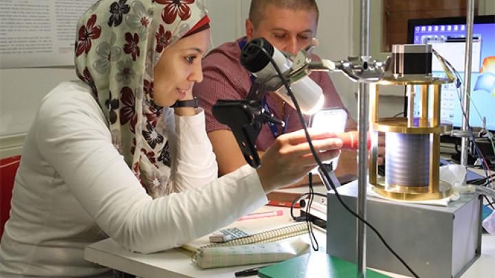 Participants of the Hands-On Research in Complex Systems School perform a low-cost, tabletop experiment