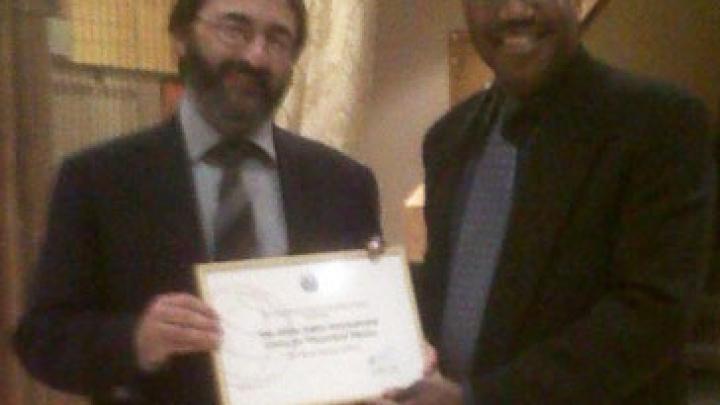 ICTP Director Fernando Quevedo receives a membership certificate from the ITU Secretary General Hamadoun Touré in Geneva